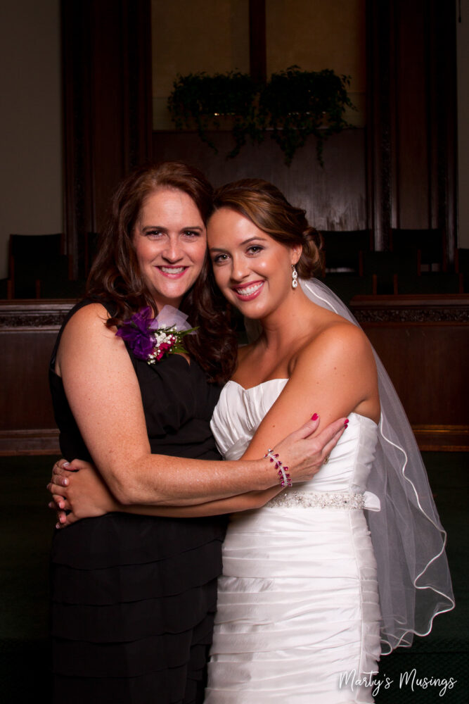 Bride and mother in church on wedding day