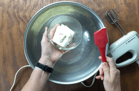 Add cream cheese to metal bowl