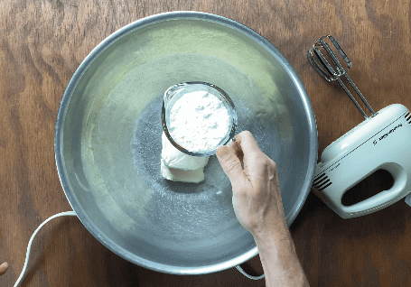 Add confectioner's sugar to metal bowl