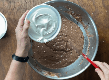Add whipped topping to chocolate mixture in metal bowl