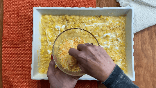 Sprinkle cheese on top of corn casserole