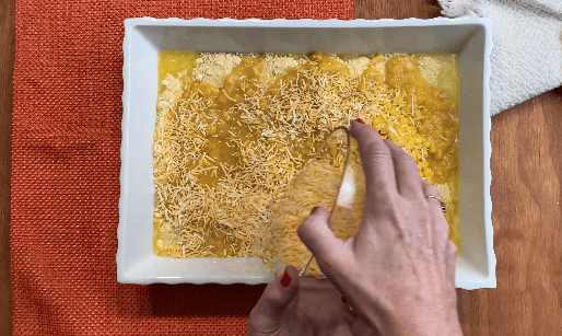 Pour shredded cheese on top of corn casserole mixture