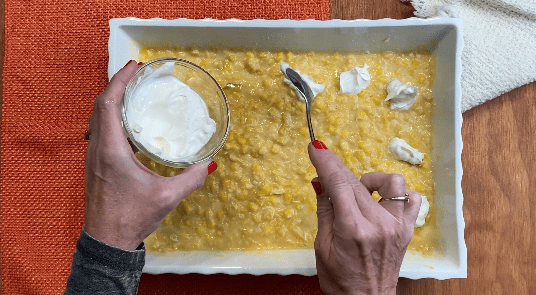 Dollop sour cream on top of corn mixture