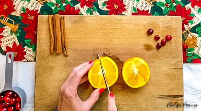 Chop oranges to make homemade potpourri