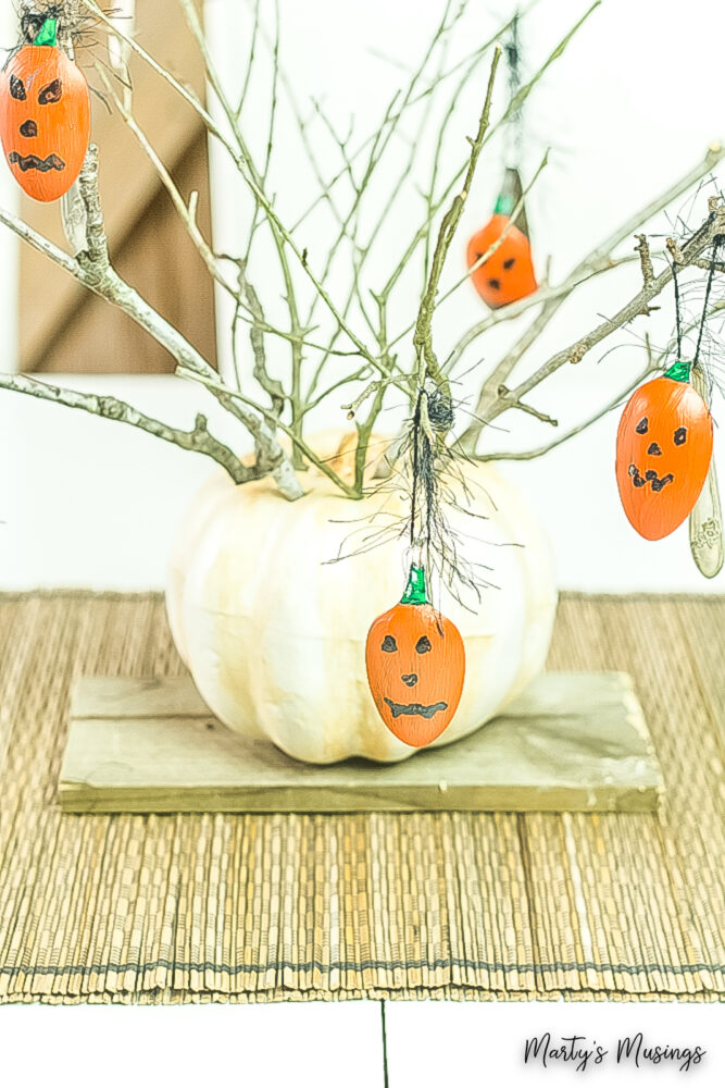Halloween centerpiece made from spoons, paint and branches