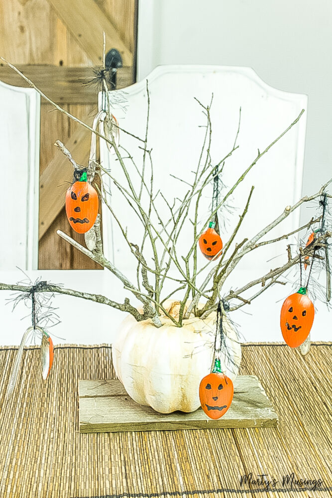 foam pumpkin filled with spoons painted as pumpkins