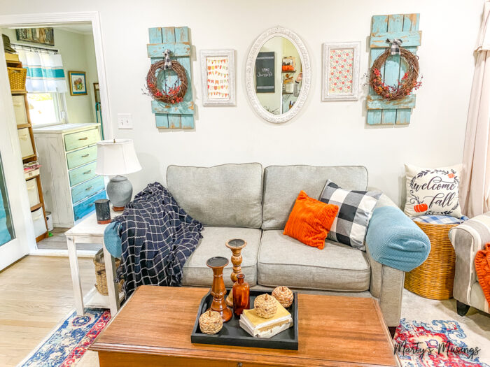 Fall living room with wreaths and black plaid throw