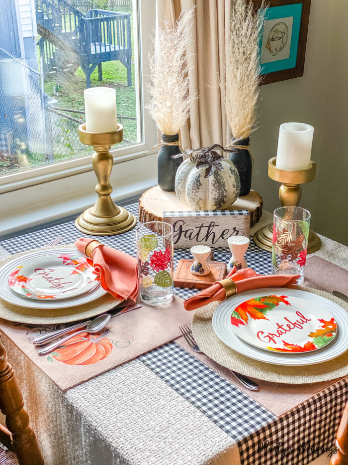 Table set for two with fall decorations in orange and black