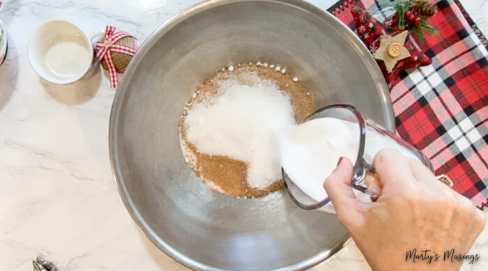 Adding sugar to metal bowl dry mix