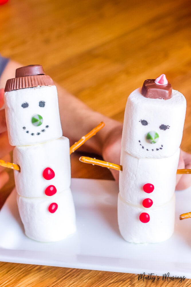 Cute Happy Little Boy and Girl Making Snowman on Christmas Holiday