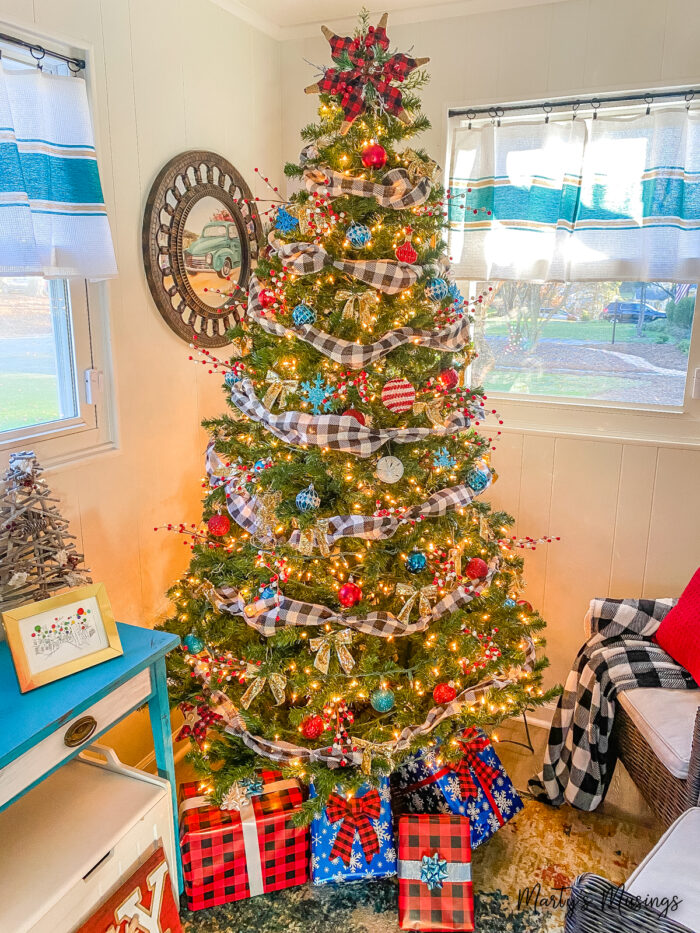 Christmas tree with black and white plaid ribbon and red and blue accents