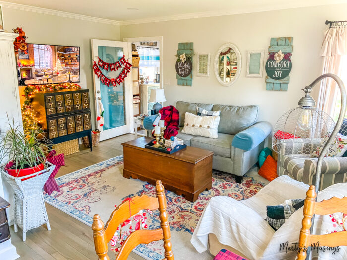 Small living room decorated for Christmas with red plaid