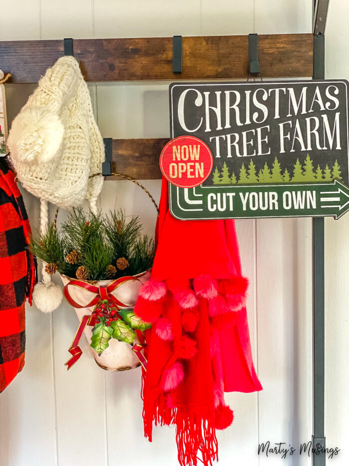 hanging shelf with scarves and greenery