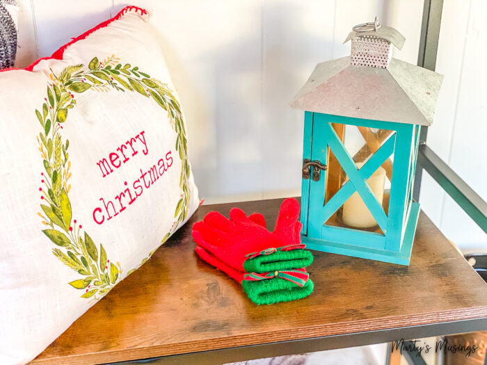 Bench with Merry Christmas pillow and lantern