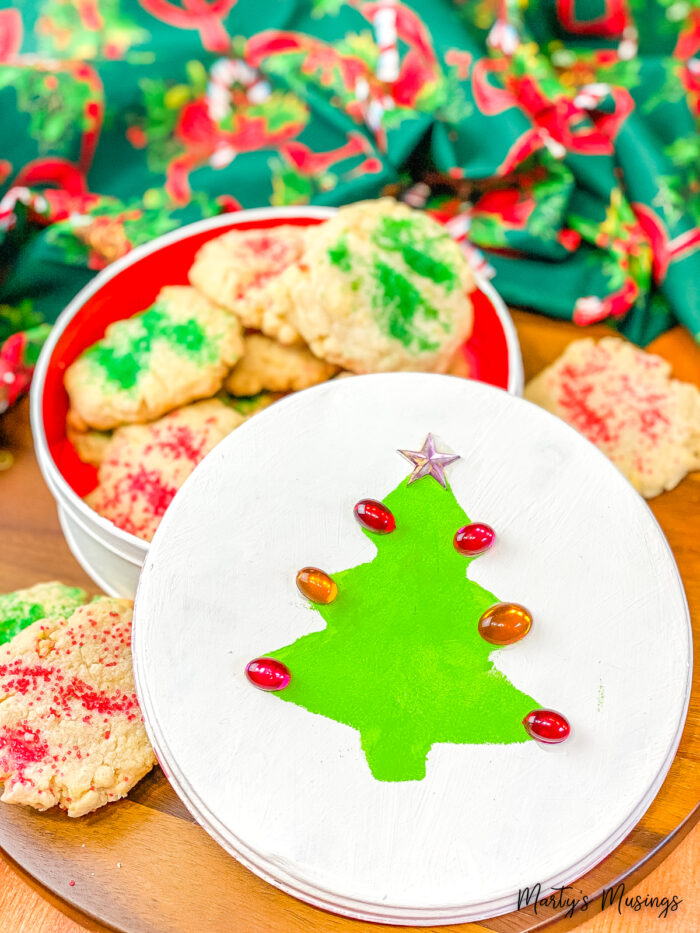 Green Christmas Tree and red jewels on white Christmas tin with sugar cookies