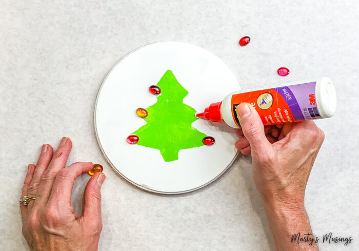 Adding red jewels to green stamped Christmas tree