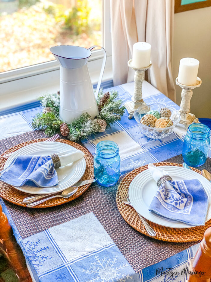 Small table with snow tablecloth and blue accents