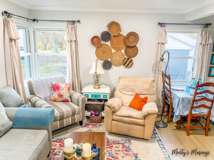 Colorful small living room with drop cloth curtains