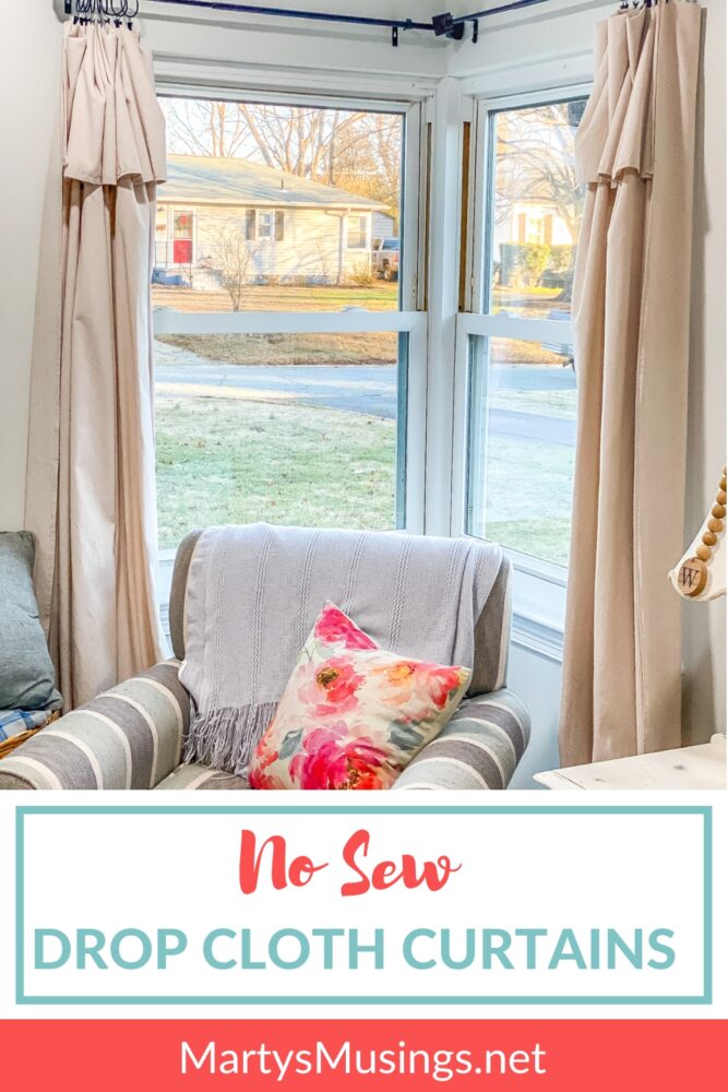 No sew drop cloth curtains with blue striped chair in front of windows