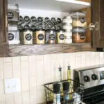 spice organization above stove in cabinet