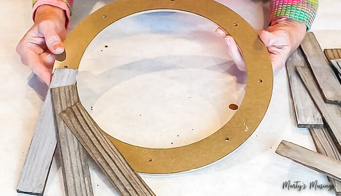 glueing stained wood shims to a wood wreath form