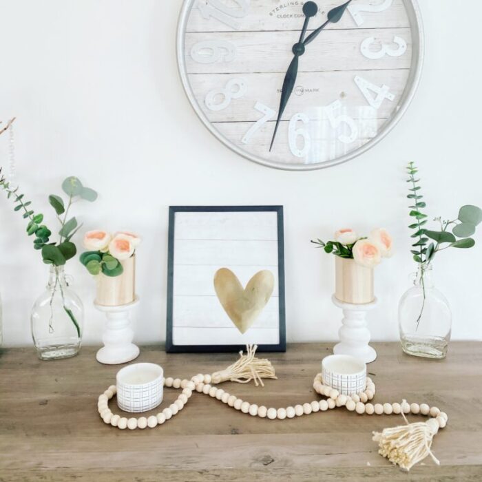 Rustic shelf with pale flowers and hearts 