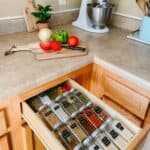 spice jars organized in a kitchen drawer