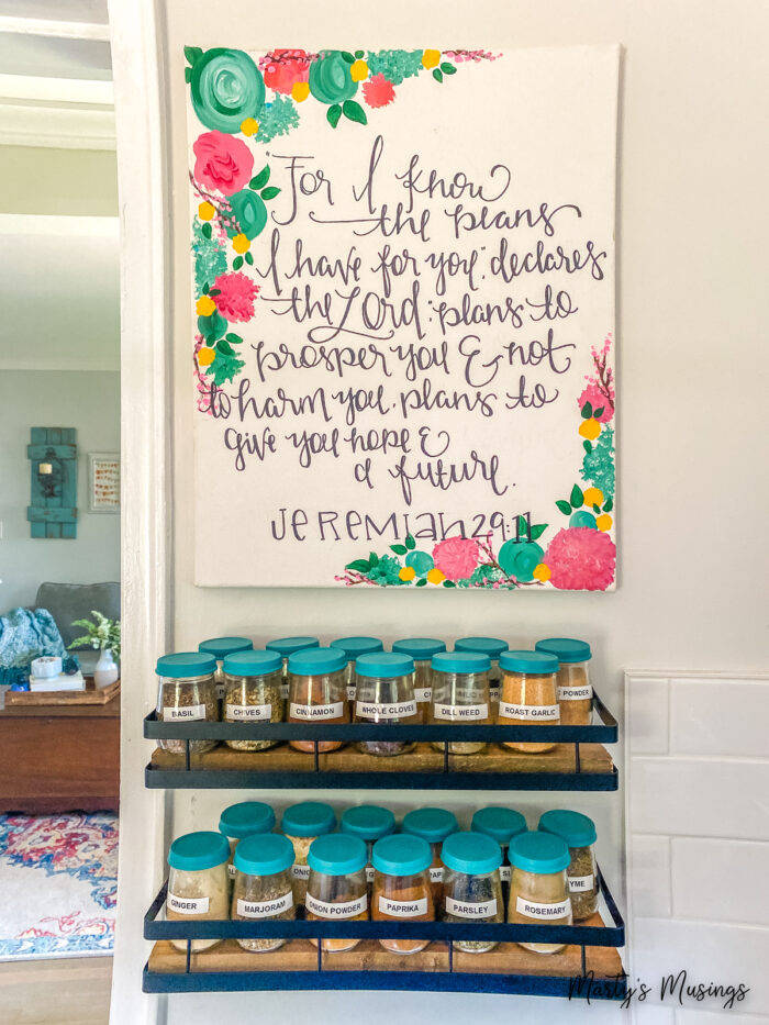 Scripture painting with spice jars below