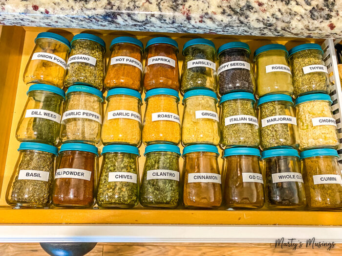 Baby food jars with labels in kitchen drawer