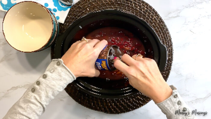 Add black beans to slow cooker taco soup