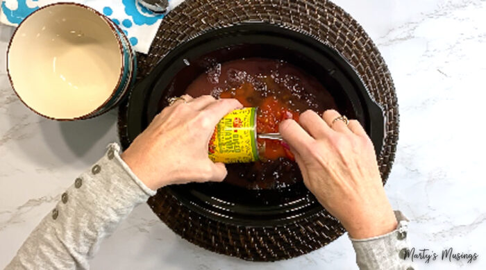 Add tomatoes and chiles to crock pot