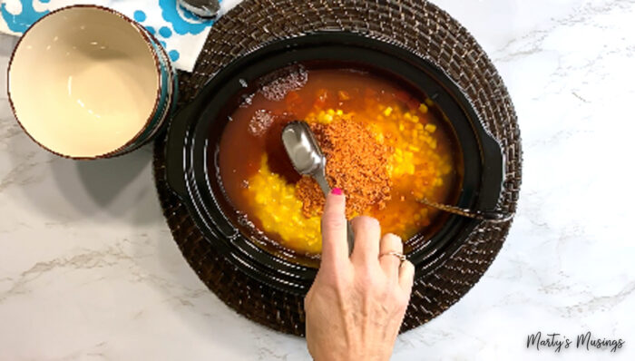 Add seasonings to slow cooker