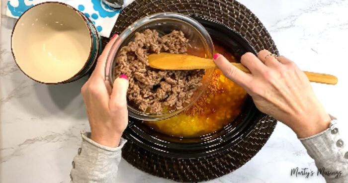 Add ground beef to crock pot for taco soup