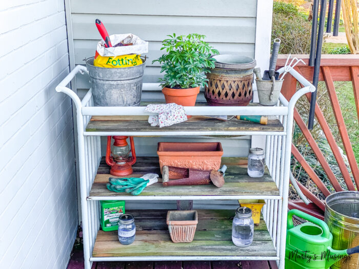 Potting bench with garden tools and plants