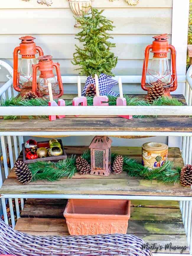 Potting table shelves decorated with Christmas decor