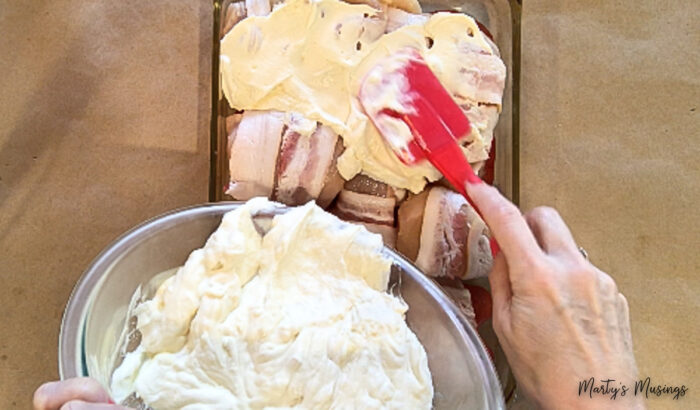 Spread sour cream mixture on top of bacon wrapped chicken 