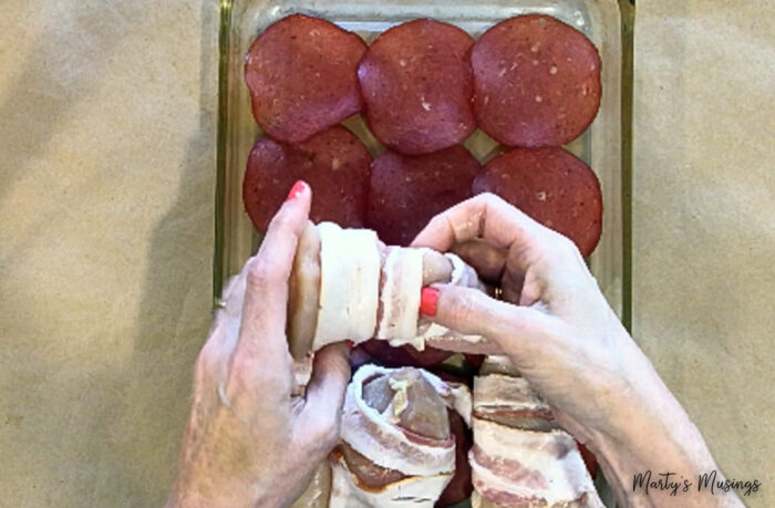 Wrap bacon and place on dried beef in glass dish