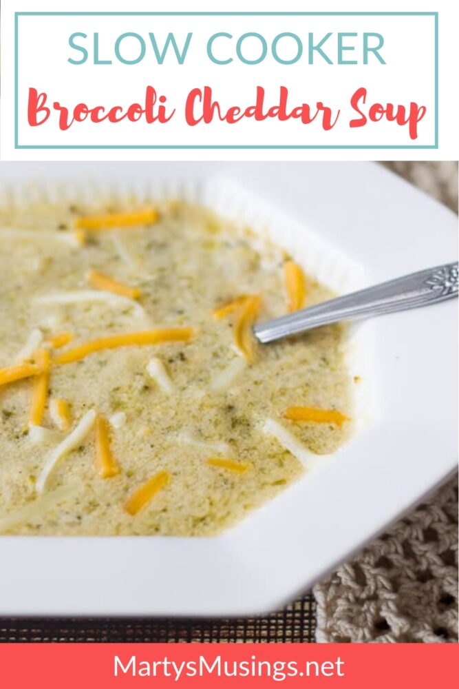 Slow cooker broccoli cheddar soup in white bowl