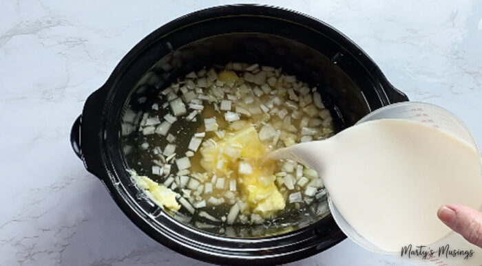 Pour milk into crock pot