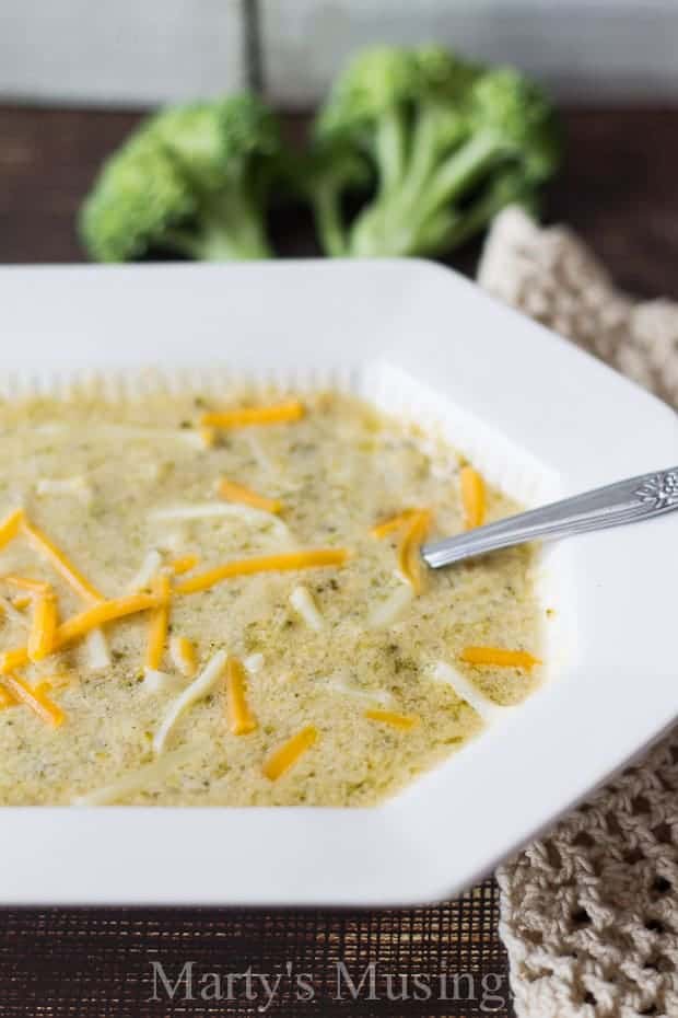 Broccoli cheddar soup in white bowl