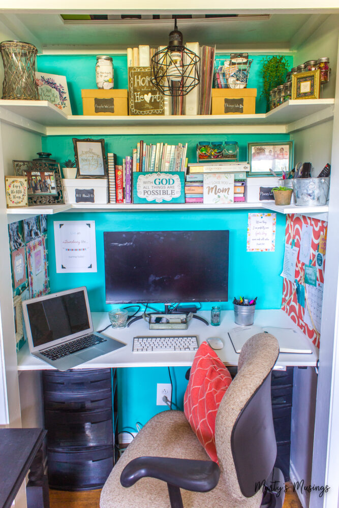 Teal back wall in home office in closet