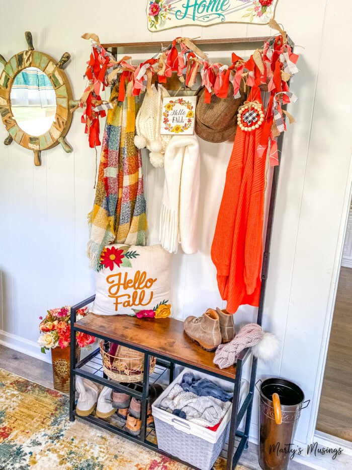 Drop zone shelves with traditional fall decor and homemade fabric banner