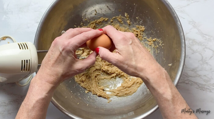 Crack egg over cookie dough