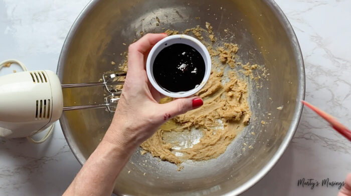 Add molasses to cookie mixture