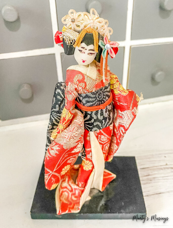 Japanese doll on stand