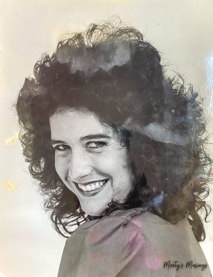 Old black and white picture of young girl with curly hair