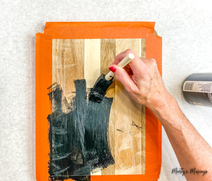 Apply chalkboard paint to cutting board.