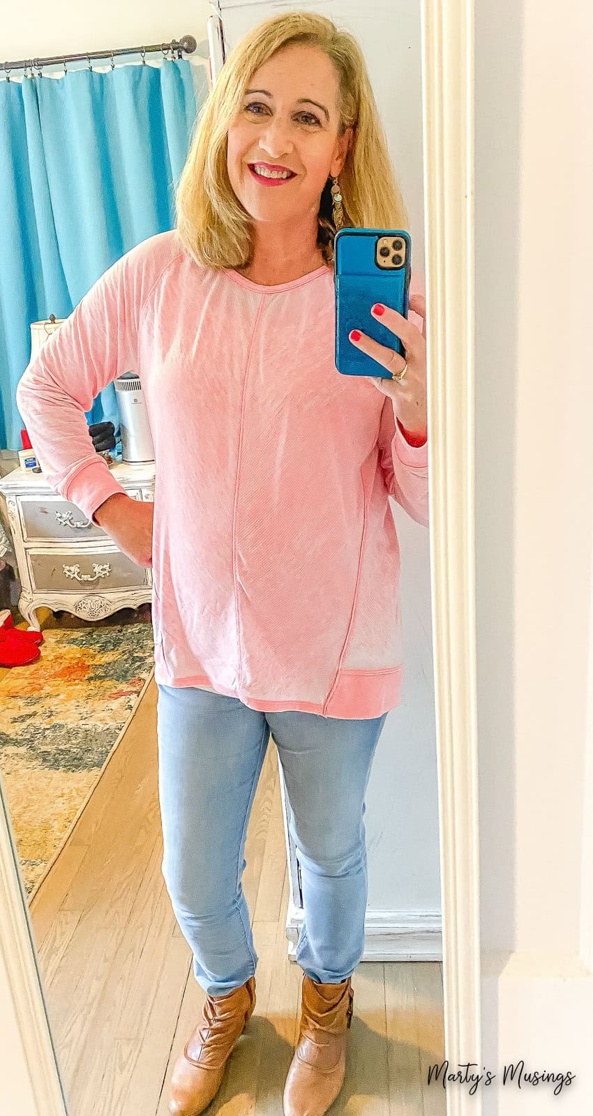Woman in pink shirt taking selfie